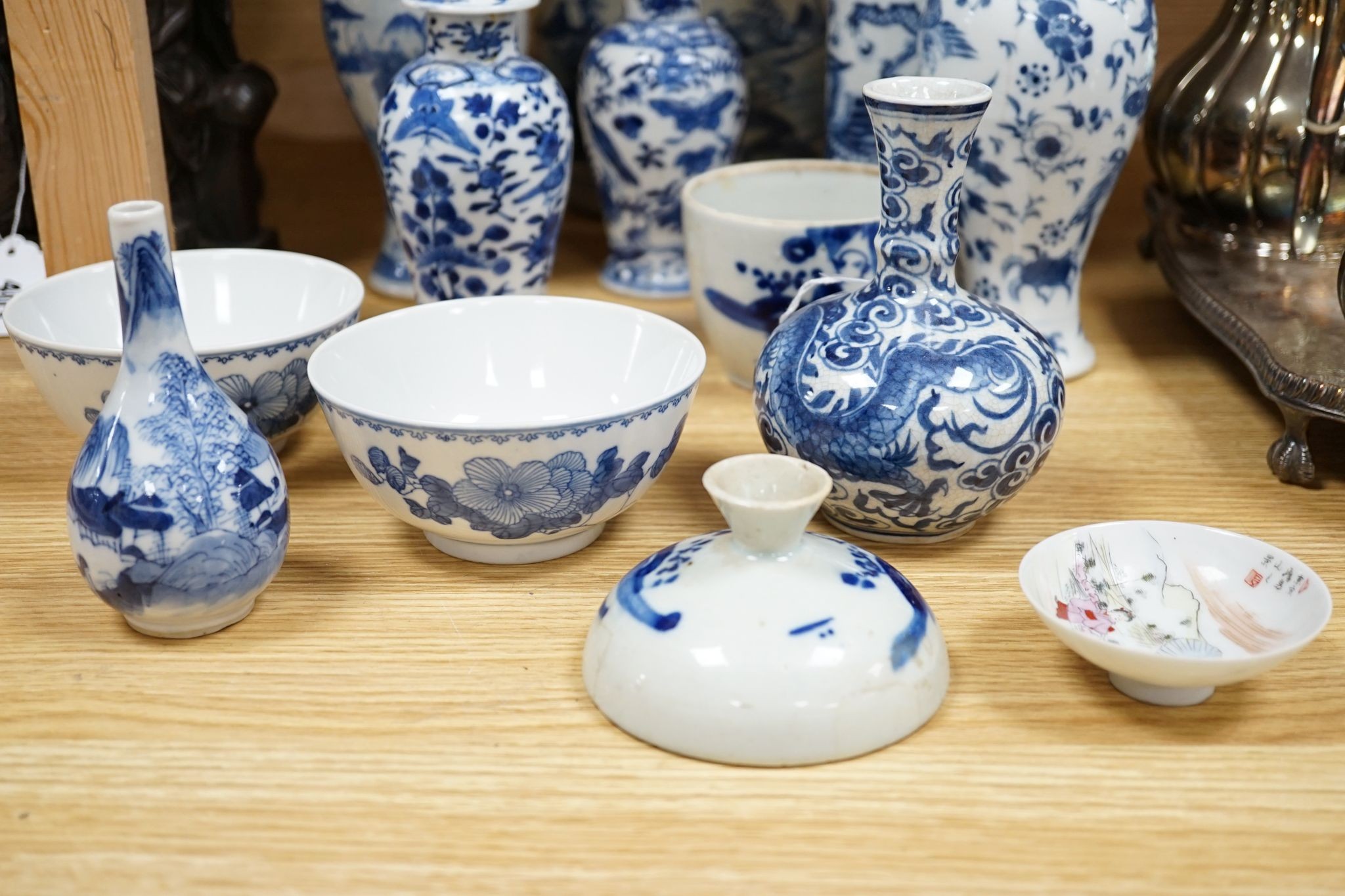 Twelve pieces of 19th century Chinese blue and white tableware and a small famille rose bowl, largest 20cm